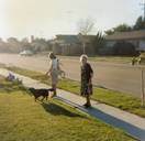 Mami and Judy are taking a walk with Fluffy on our street in Camarillo.